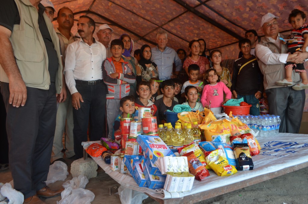 Dr. Eibner with a displaced Iraqi family who received food aid through CSI's donors.